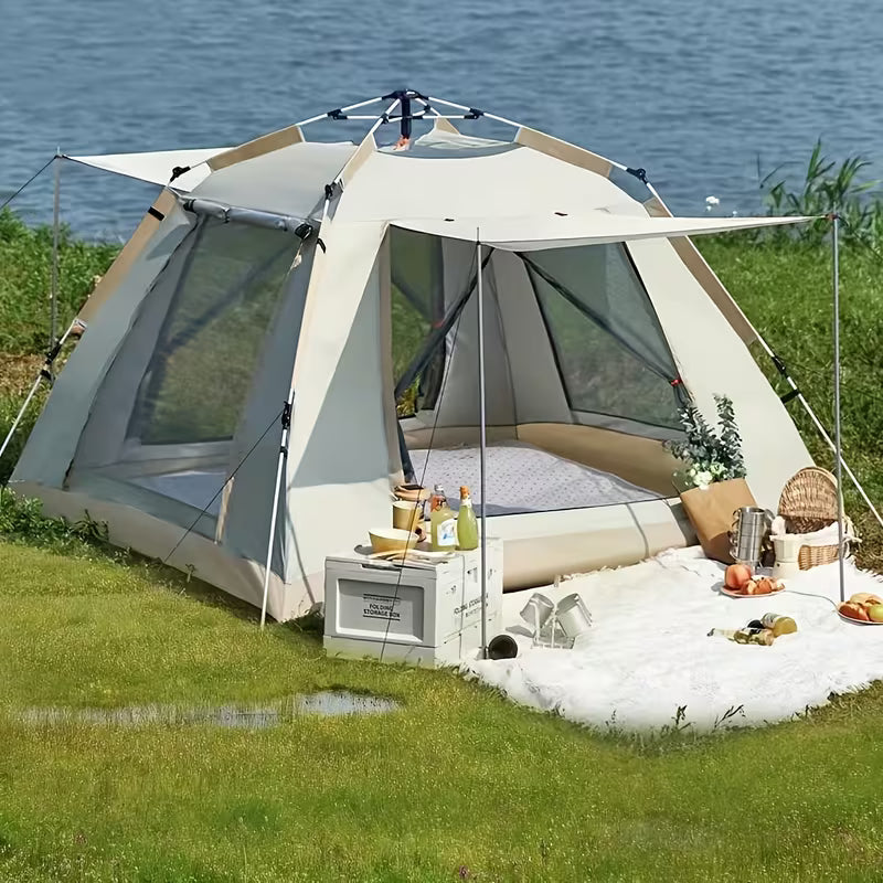 Camping tent with outdoor furniture and food near a body of water Biggreenbear.com