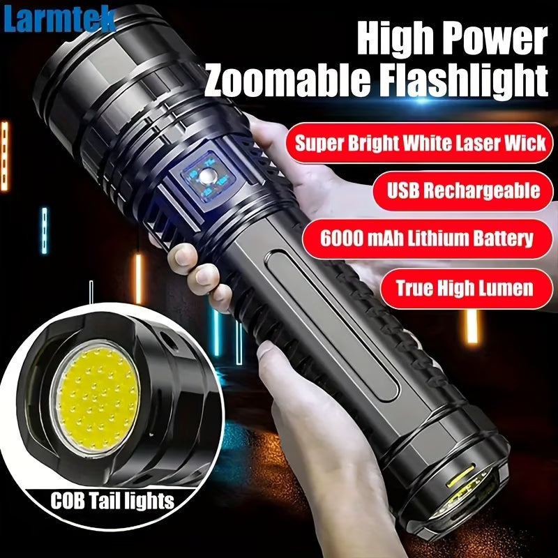 High power zoomable flashlight with USB rechargeable feature, held by a hand. Biggreenbear.com Big Green Bear
