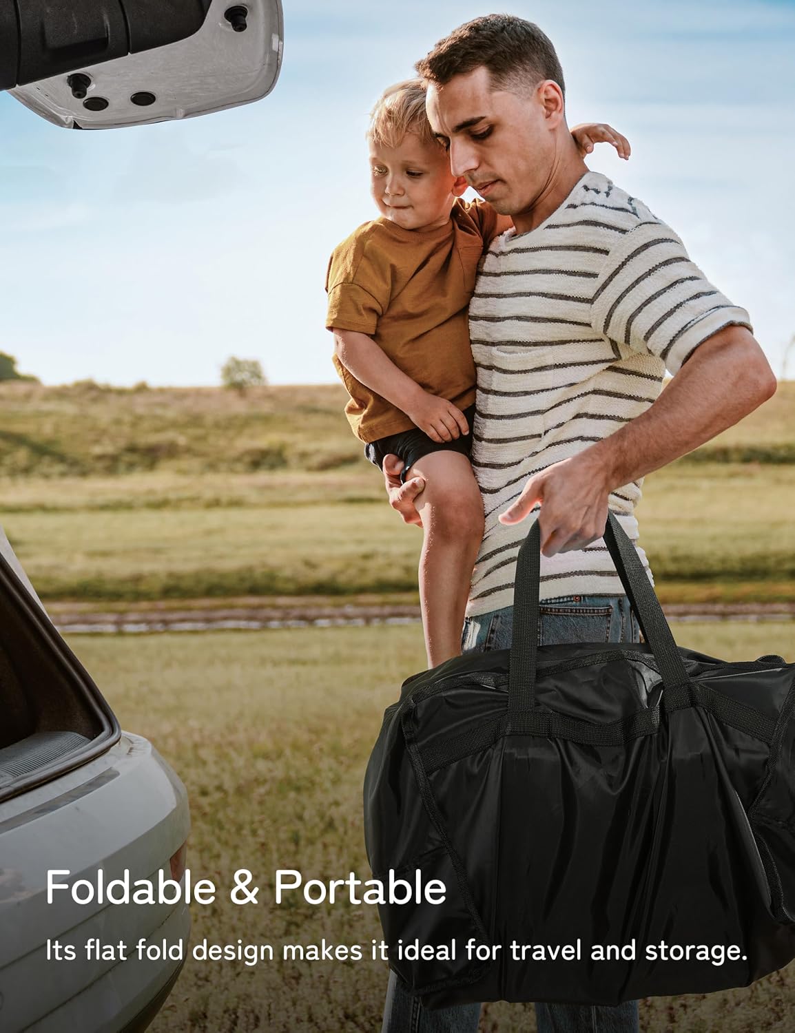 Man holding a child and a black duffel bag with text about its foldable and portable design.