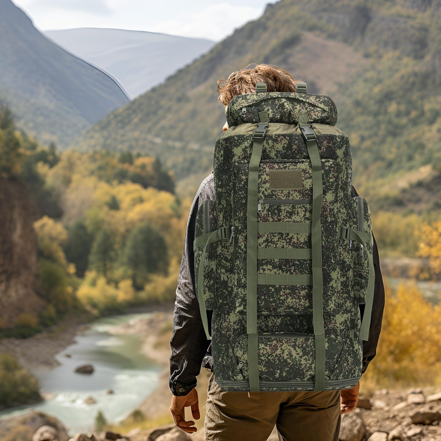 Hiker wearing the Big Green Bear 100L green assault pack on a multi-day climbing trip.