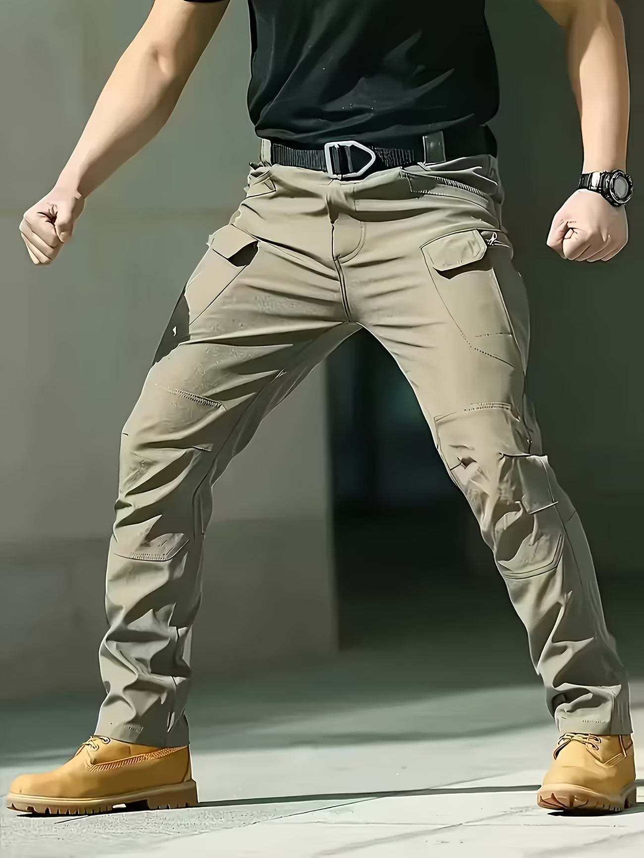 Person wearing beige tactical pants with a blurred background