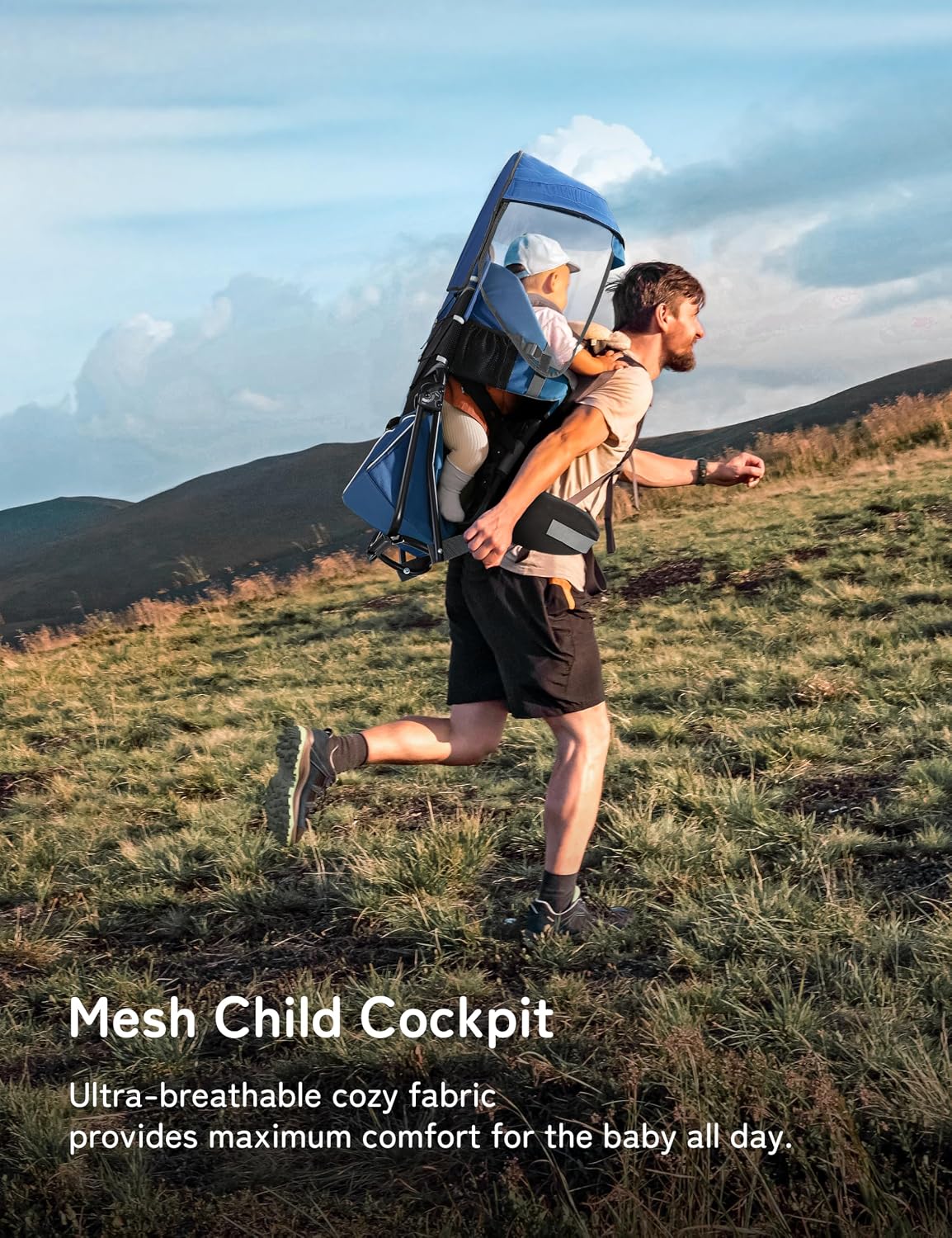 Man running outdoors with a baby in a blue mesh child carrier