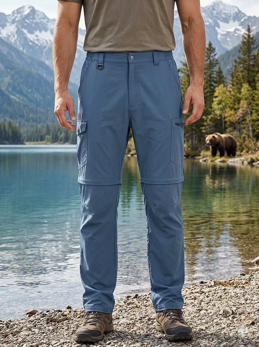 Person wearing blue hiking pants with a bear and lake in the background