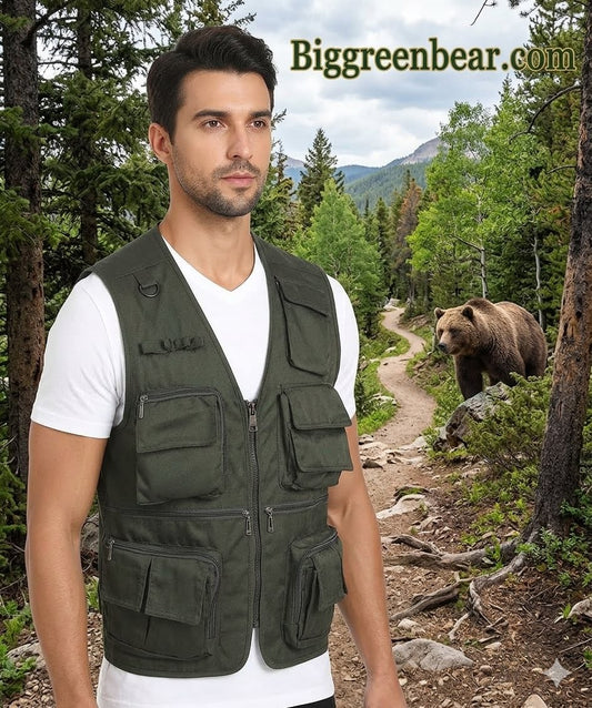Man wearing a green vest standing in a forest with a bear in the background, featuring Biggreenbear.com.