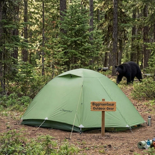 Green tent in a forest with a bear in the background and a 'Biggreenbear Outdoor Gear' sign.