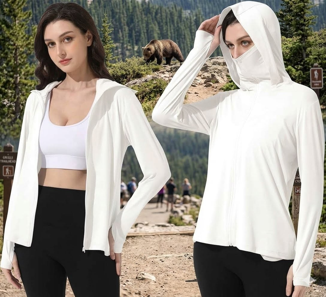 Two women wearing white hoodies with a bear and mountainous landscape in the background big green bear
