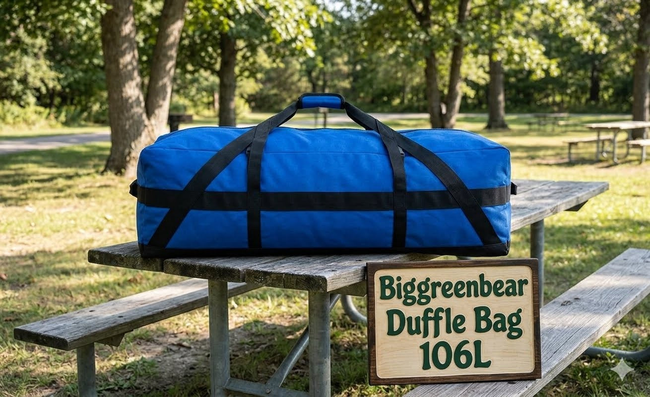 Blue duffel bag with black straps on a wooden picnic table in a park setting, featuring 'Biggreenbear Duffle Bag 106L' sign.