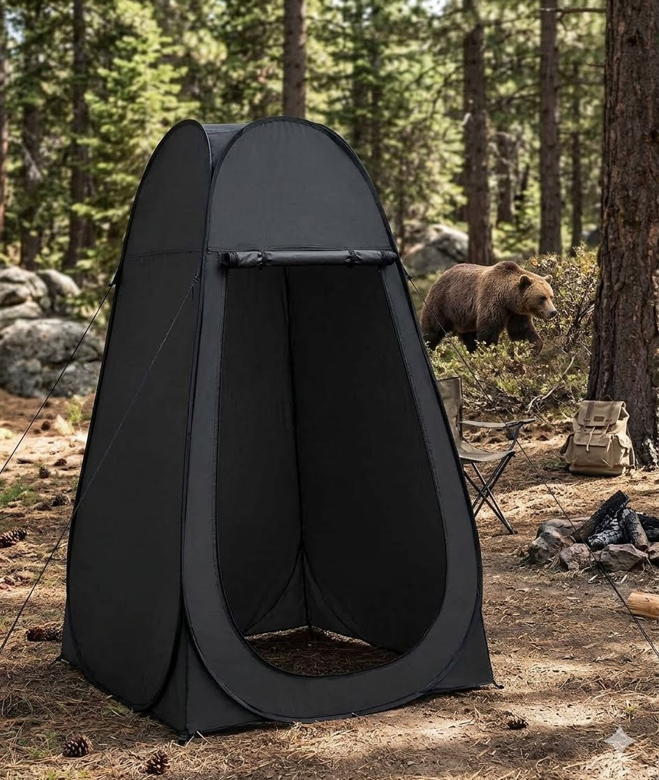 Black pop-up tent in a forest setting with a bear in the background big green bear