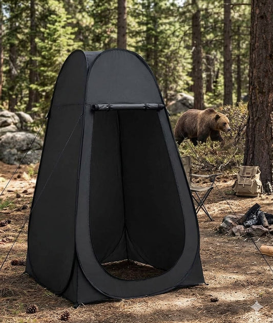 Black pop-up tent in a forest setting with a bear in the background big green bear