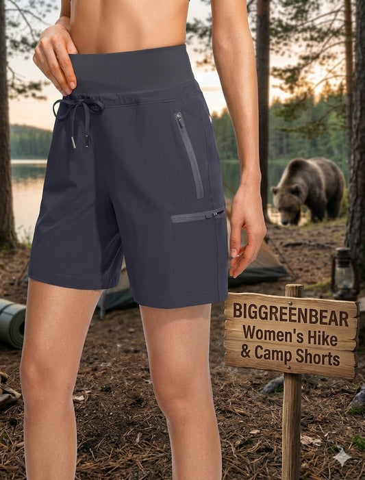 Person wearing navy blue shorts with a bear and camping sign in the background big green bear