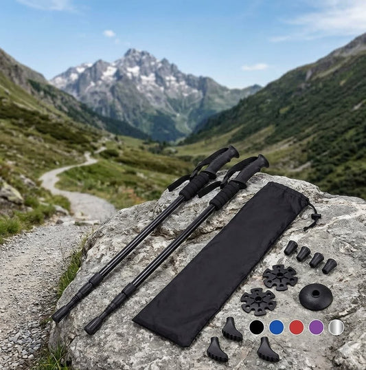 A pair of lightweight, three-section telescoping trekking poles fully extended and standing upright against a plain white background. Big green bear