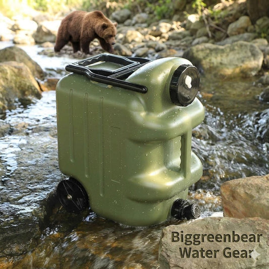 An olive green water container with black lids and handle, partially submerged in a flowing stream outdoors, with a brown bear walking in the background. Text overlay reads 'Biggreenbear Water Gear'.