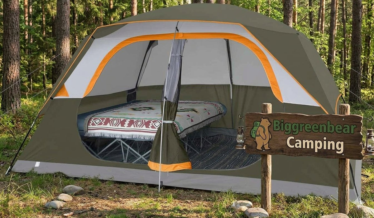 A dome-style camping tent with a green, white, and orange color scheme is pitched in a forest clearing. The front door is open, revealing a camping bed inside.