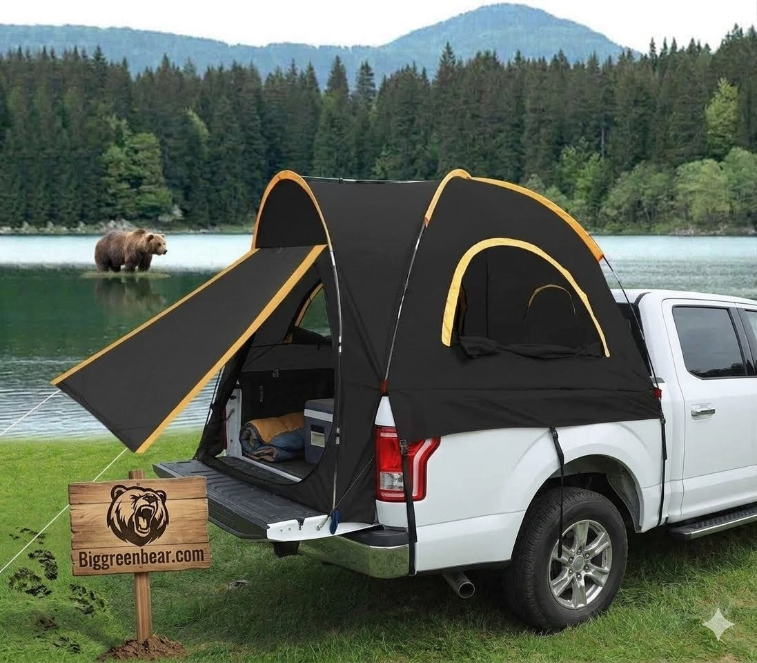 Black and yellow truck bed tent attached to a white pickup truck by a lake with a bear in the background.