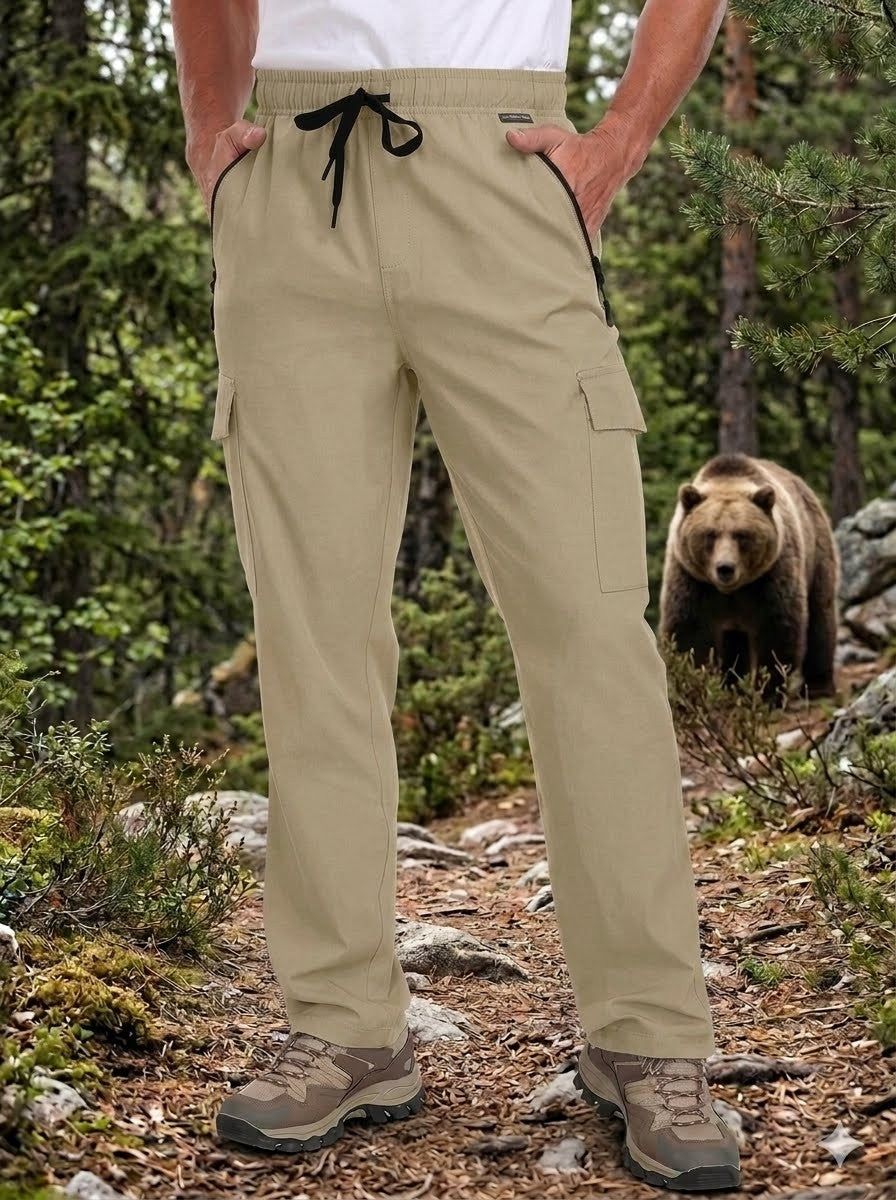 Person wearing beige pants with a bear in the background in a forest setting Biggreenbear.com