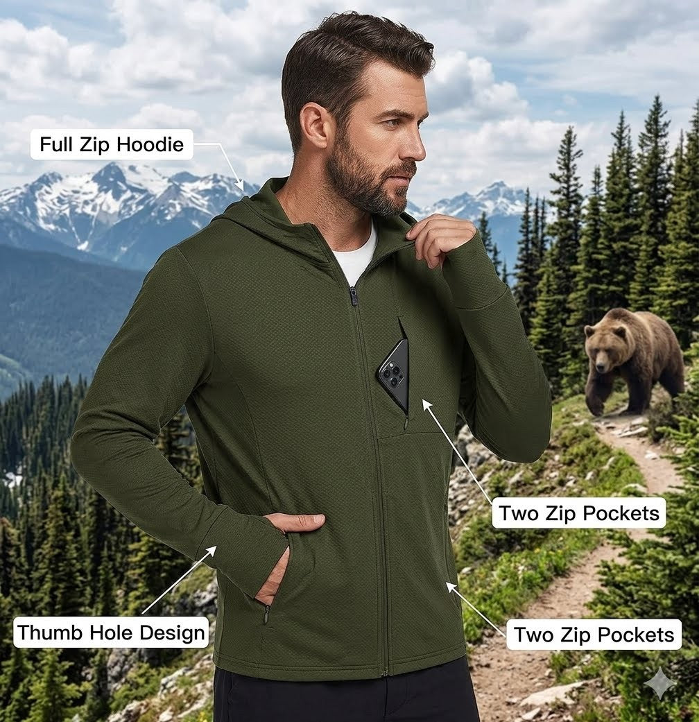 Man wearing a green hoodie with features highlighted in a mountainous forest setting