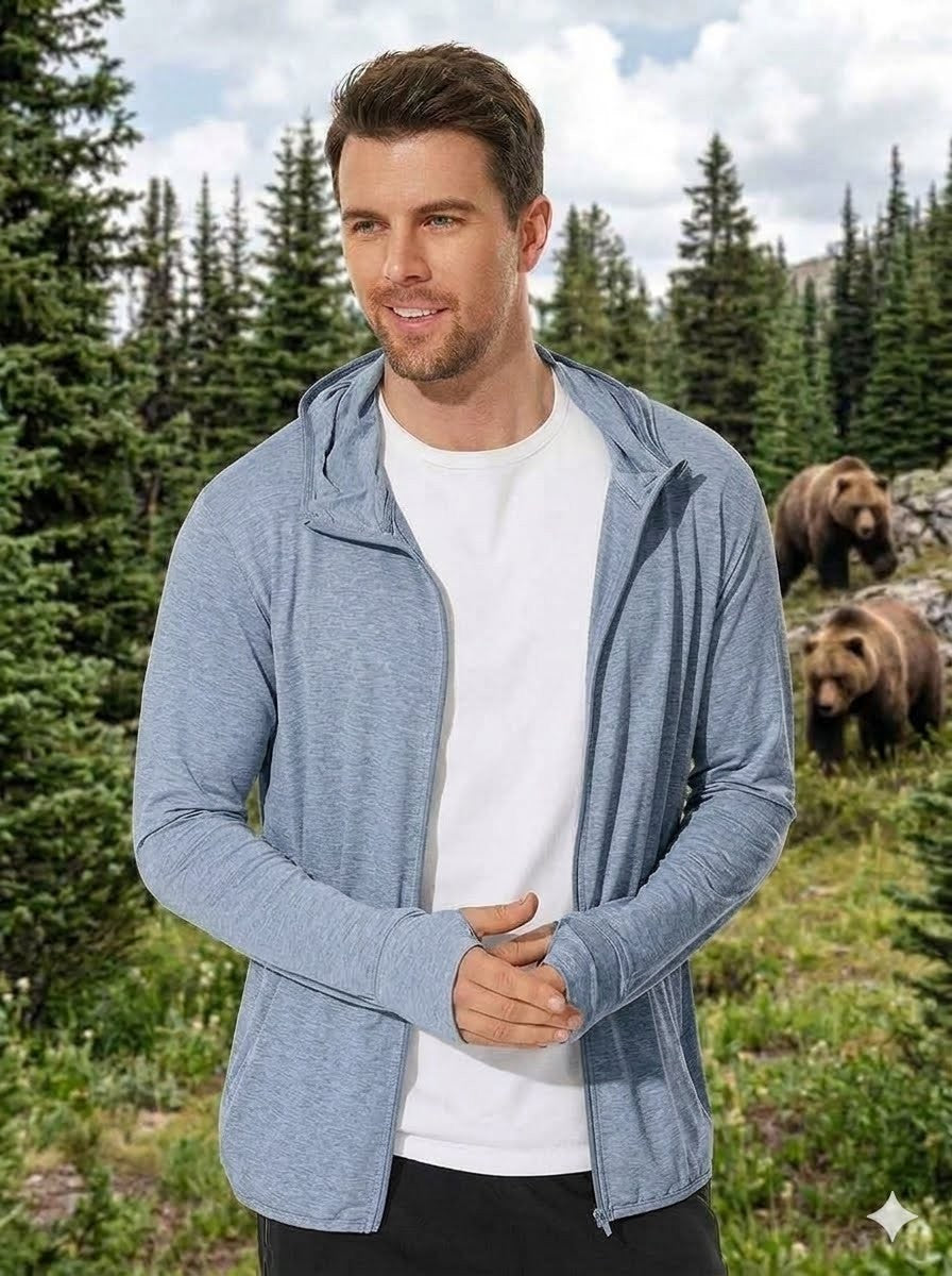 Man wearing a blue zip-up hoodie with bears in the background Big Green Bear