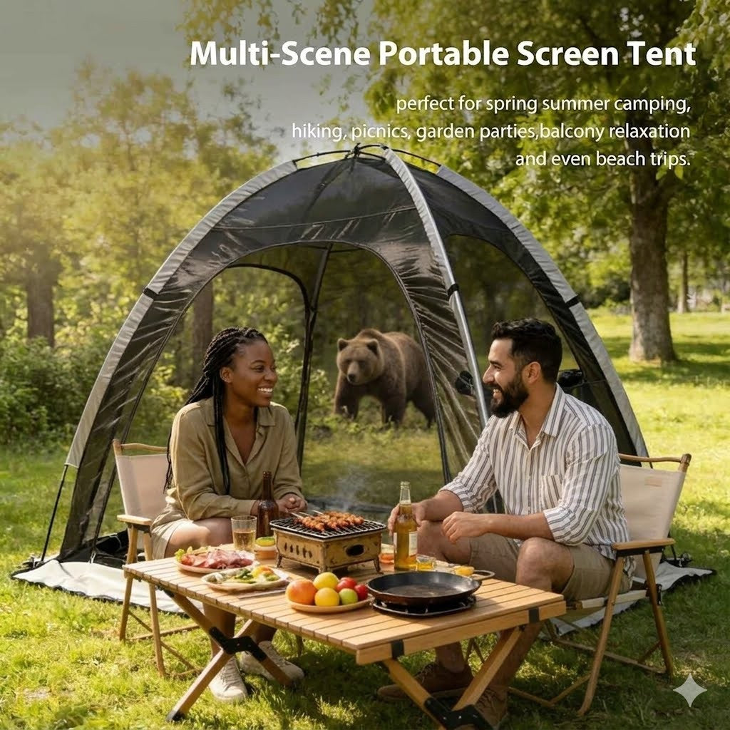 Two people sitting under a multi-scene portable screen tent in a park with a bear in the background.