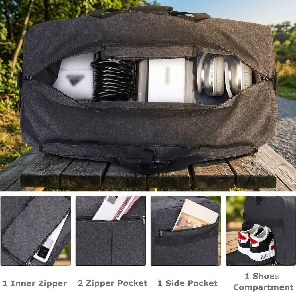 Black travel bag with compartments on a wooden surface outdoors
