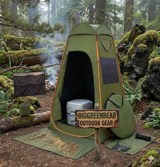 Green outdoor shower tent in a forest setting with 'BIGGREENBEAR Outdoor Gear' sign.