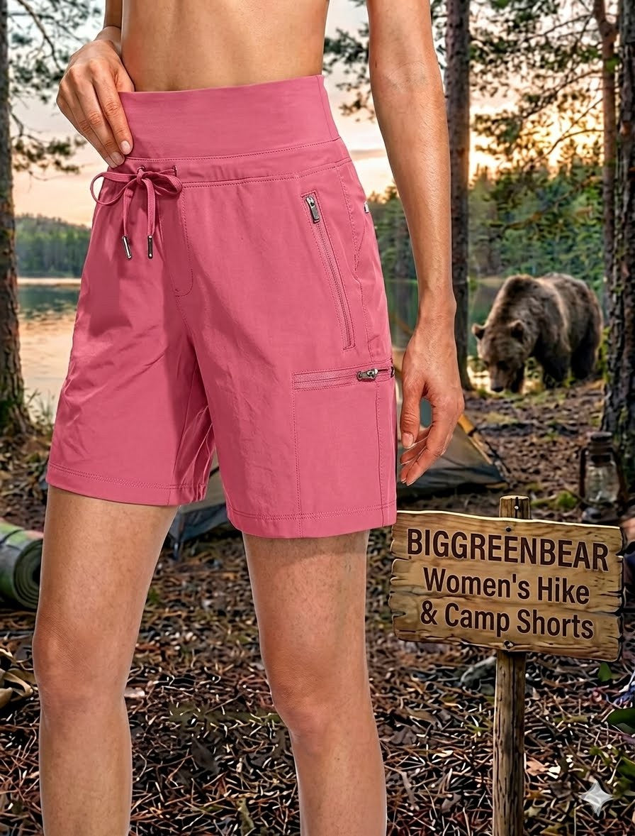 Person wearing pink shorts in a forest with a bear in the background, next to a 'BIGGREENBEAR Women's Hike & Camp Shorts' sign.