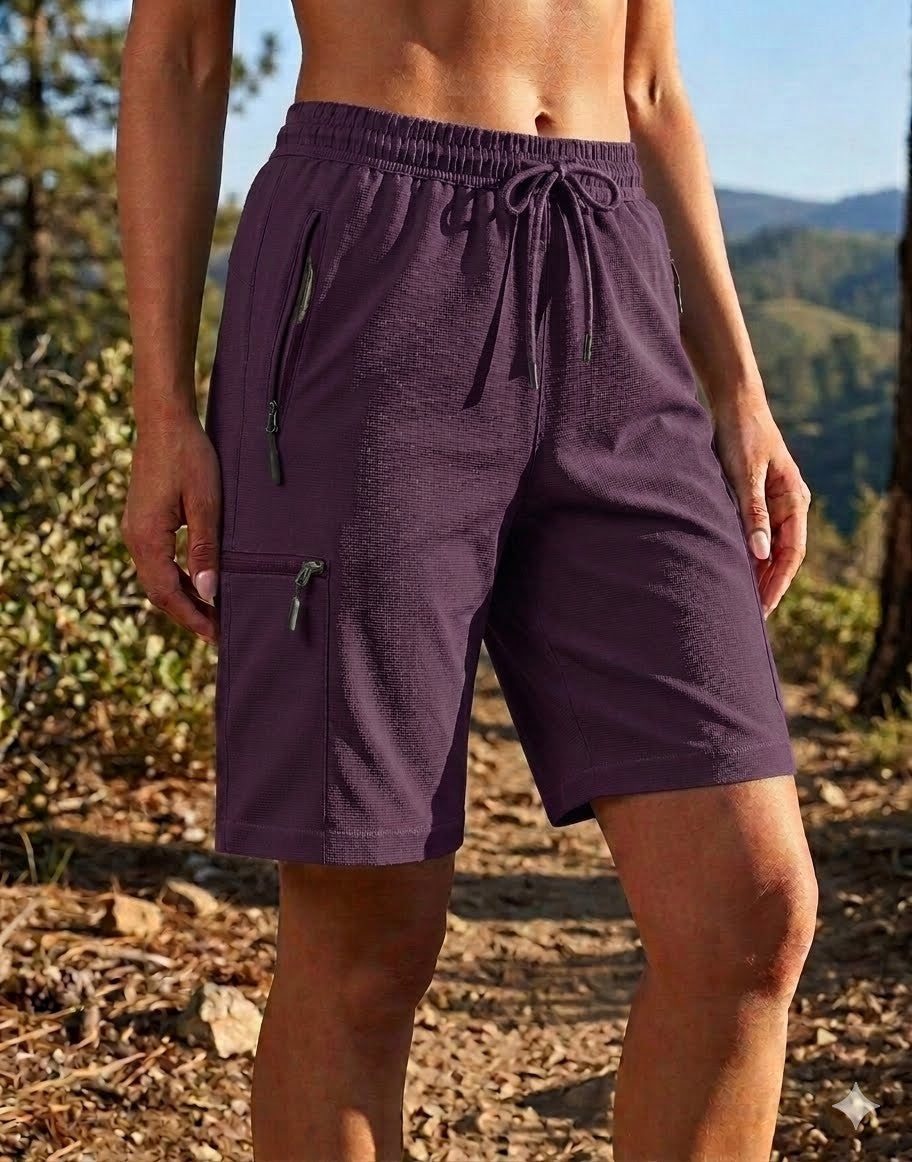 Person wearing purple shorts with zippers in a natural setting big green bear