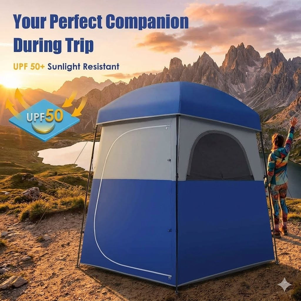 Blue camping tent with UPF 50+ text in a mountainous landscape