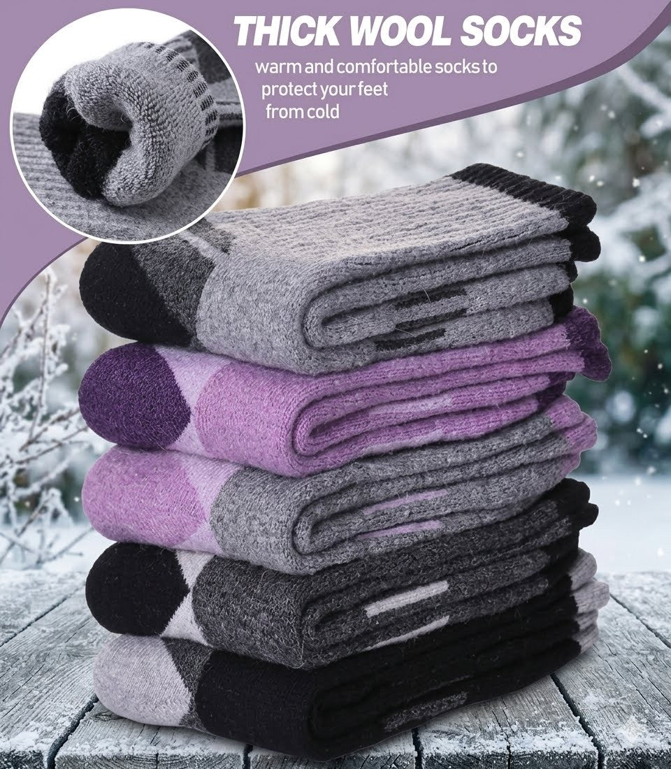 Stack of thick wool socks with a snowy background