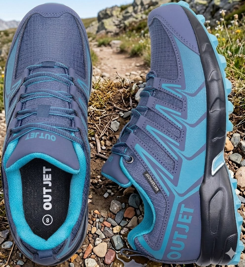 A pair of outdoor trail running shoes in blue and teal, shown from the top and side against a rocky, grassy mountain path background. The brand 'OUTJET' is clearly visible on the tongue and heel.