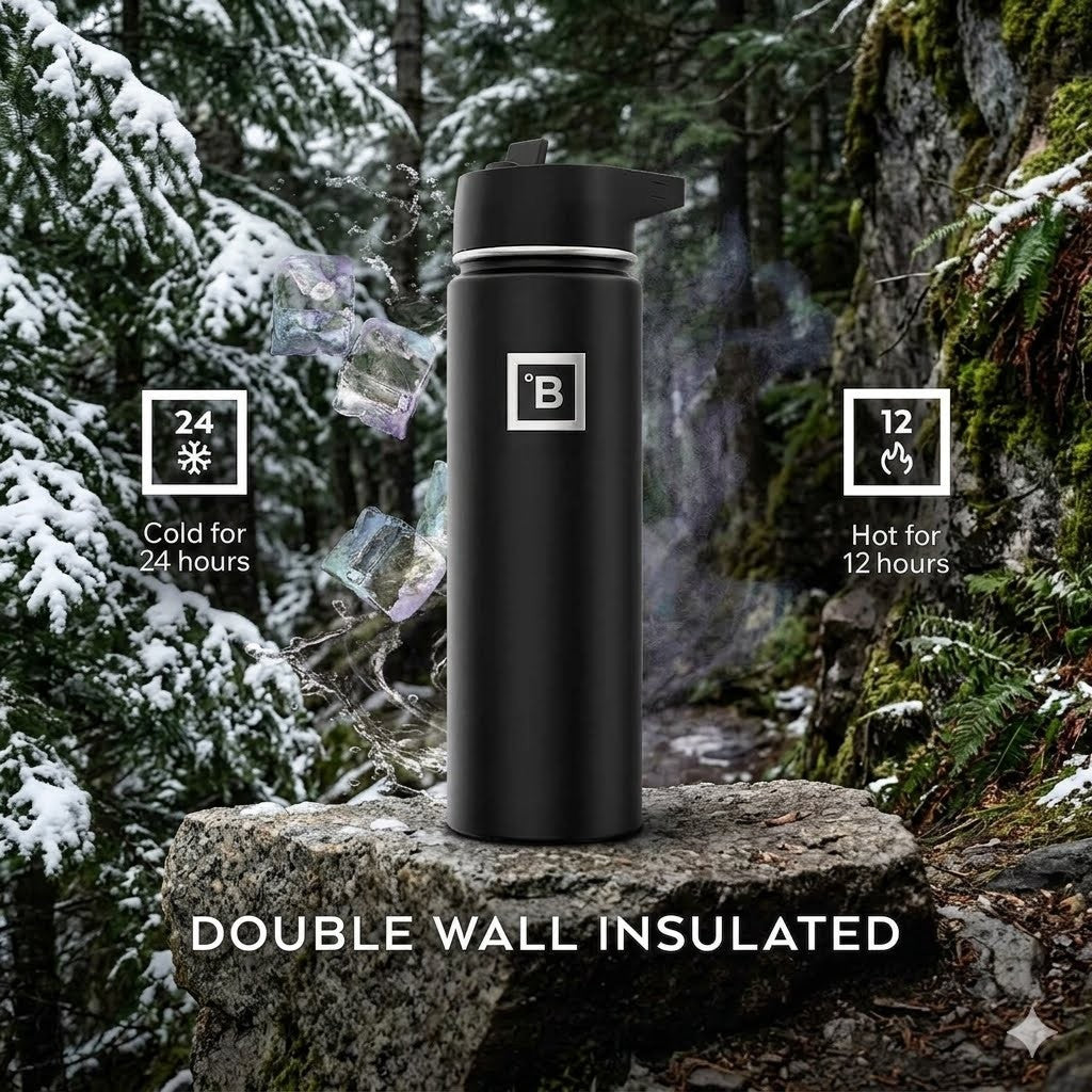 A matte black insulated water bottle with a flip-top lid stands on a rock in a snowy forest setting. White text at the bottom reads “DOUBLE WALL INSULATED,” and feature callouts on the left and right say “24 hours Cold” and “12 hours Hot.