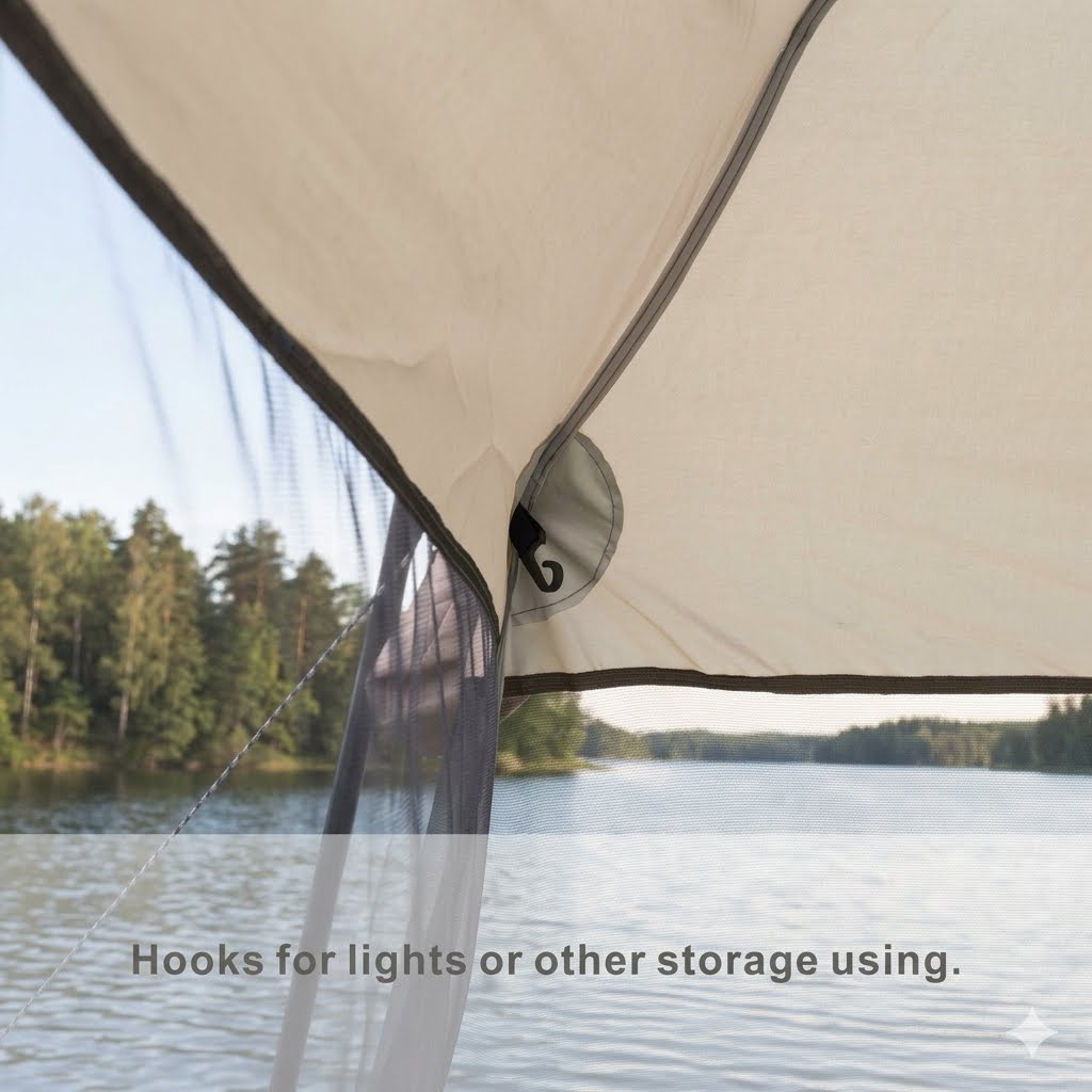 Close-up of a beige tent or canopy with a mesh side panel and a circular hook detail, shown outdoors over a lake with trees in the background. Text at the bottom reads, 'Hooks for lights or other storage using.