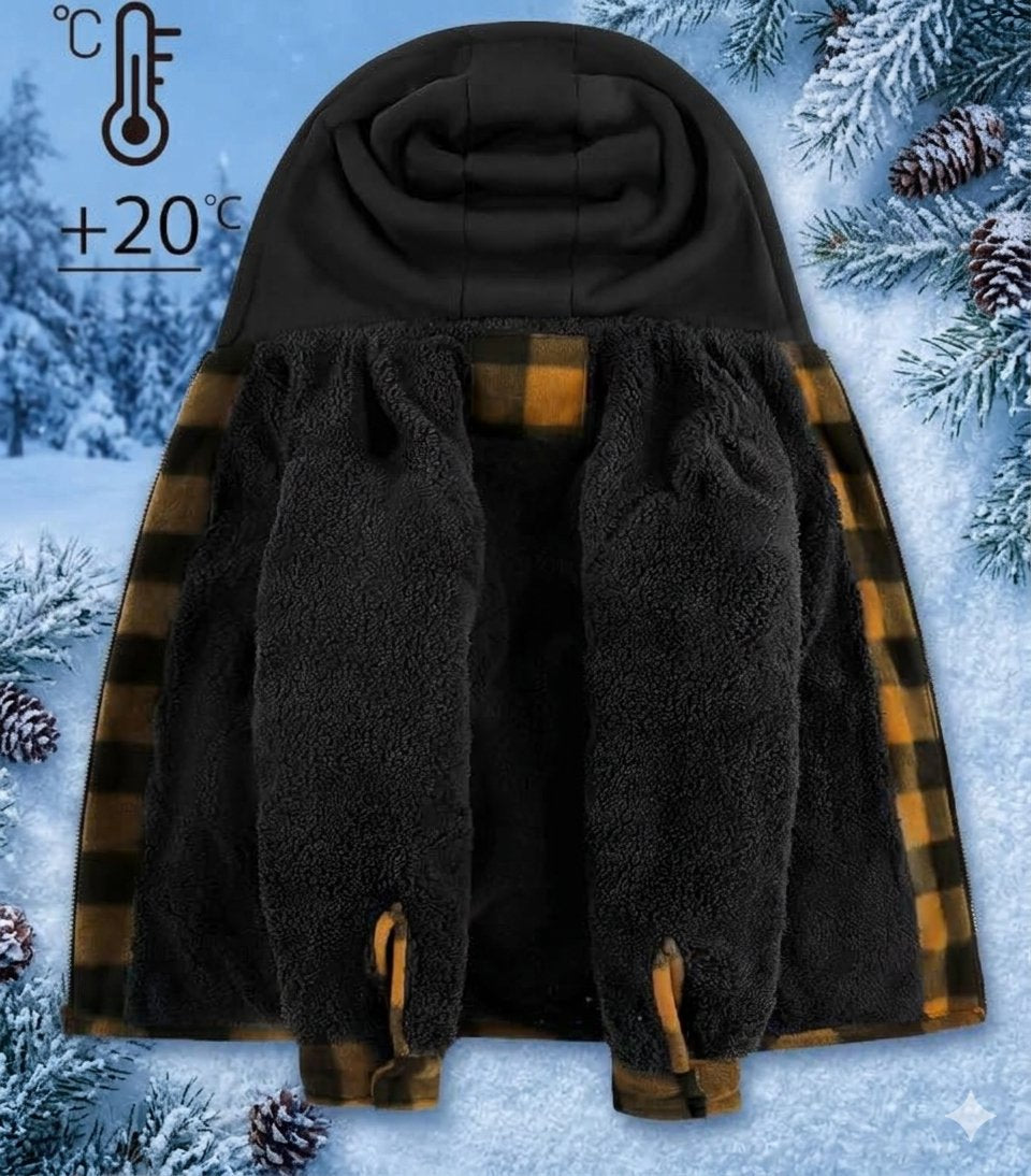 A black fleece-lined hooded wearable with brown and black plaid trim, shown against a snowy winter background with pine branches and pinecones. A thermometer icon with '+20°C' appears in the upper left.