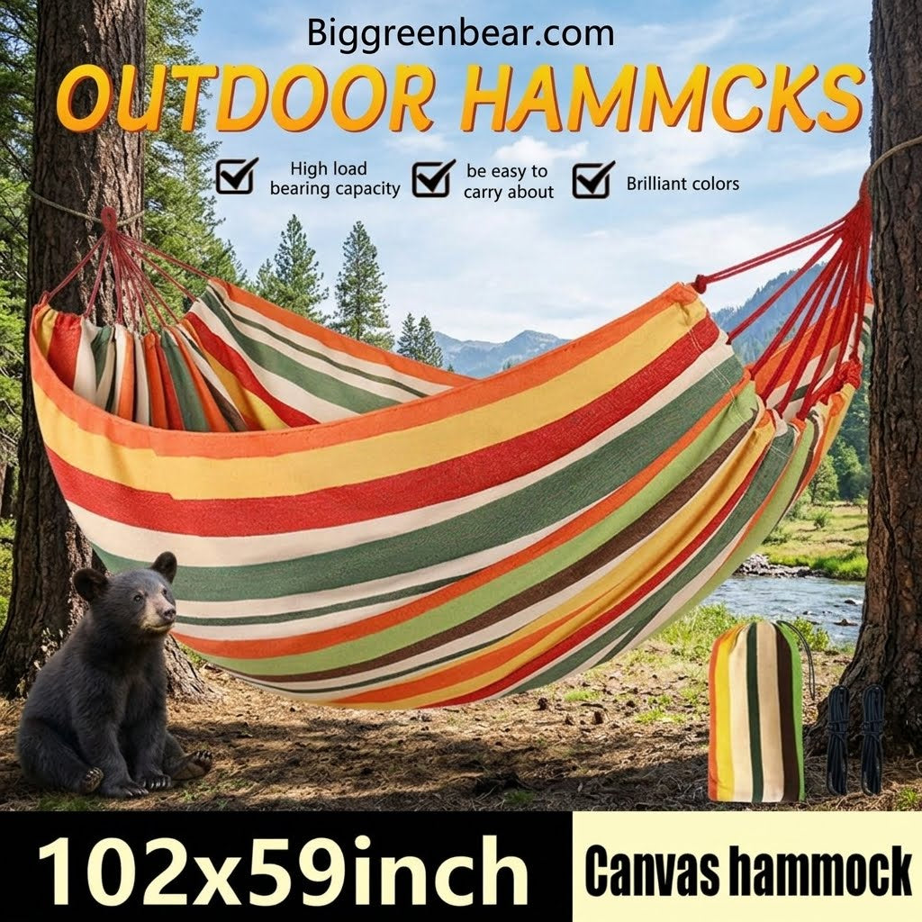 A striped canvas outdoor hammock suspended between two trees in a forest setting, with a small bear sitting below on the ground. Large text at the top reads 'OUTDOOR HAMMACKS' and '102x59inch Canvas hammock', with the brand 'Biggreenbear.