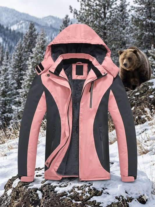 Pink and black jacket in a snowy landscape with a bear in the background Big Green Bear