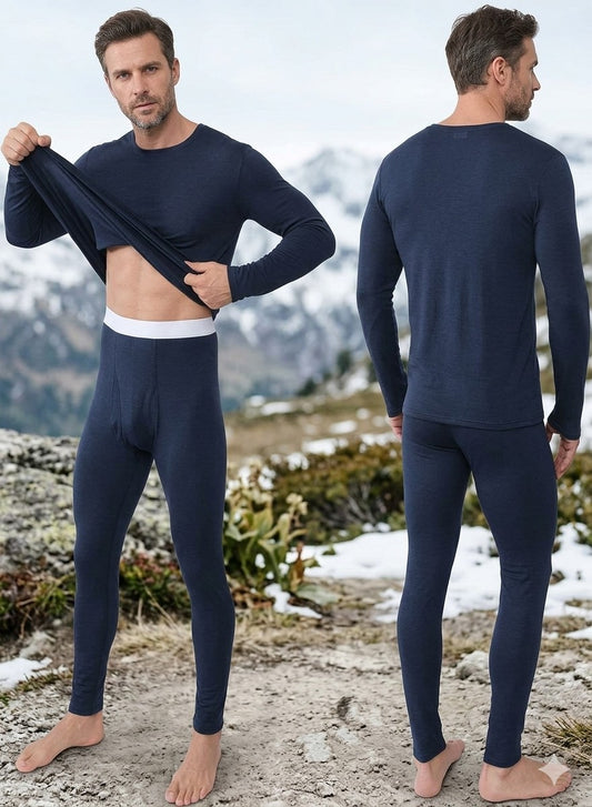 Man wearing navy blue thermal underwear set with mountains in the background Big Green Bear