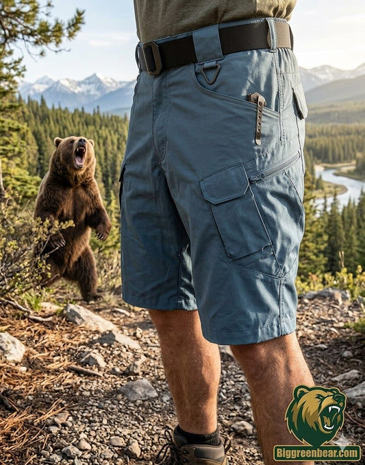  "Big Green Bear Men's 9-inch lightweight tactical hiking shorts in slate blue, featuring cargo pockets and an ergonomic cut for outdoor mobility."