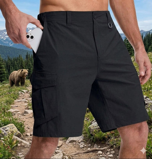 Person wearing black cargo shorts with a bear in the background