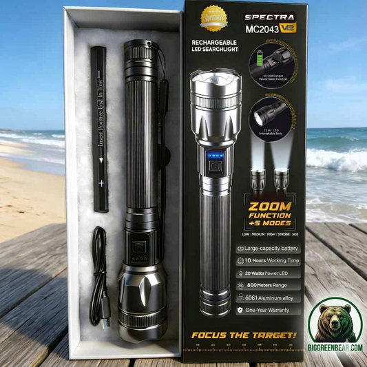 Spectra MC2043 rechargeable LED searchlight with packaging on a beach background Biggreenbear.com Big Green Bear
